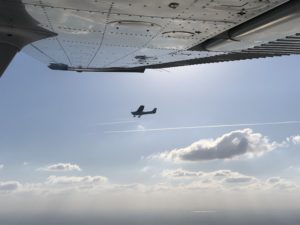 Wing View of Cessna 172 parallel flying